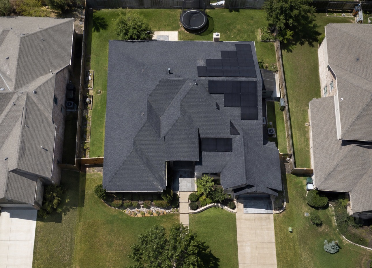 Overhead view of a Texas home with a rear-facing rooftop solar array